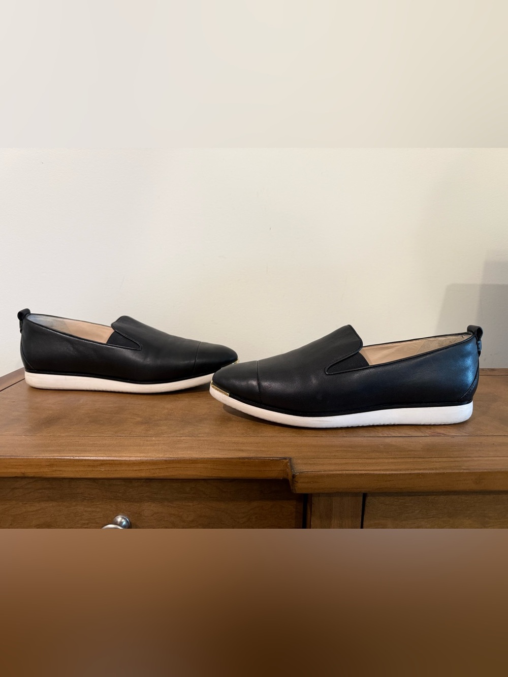 Cole Haan Women’s Black Leather Slip-On Sneakers with White Sole